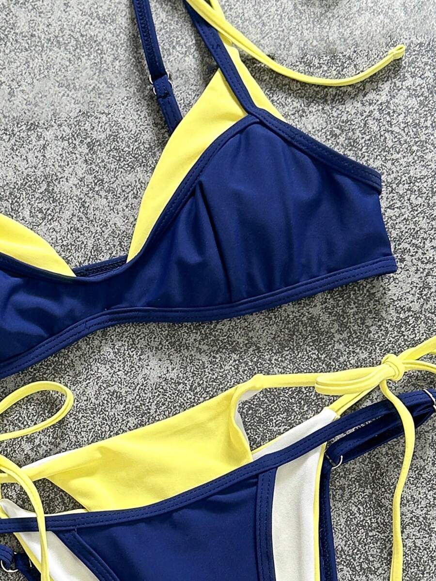 Women's retro polka dot high waist bikini swimsuit set with spaghetti straps and knot tie-back top.