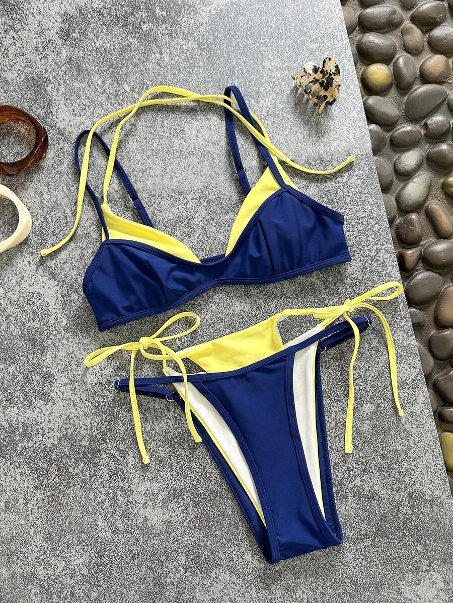 Women's retro polka dot high waist bikini swimsuit set with spaghetti straps and knot tie-back top.