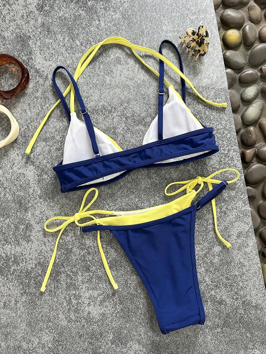Women's retro polka dot high waist bikini swimsuit set with spaghetti straps and knot tie-back top.