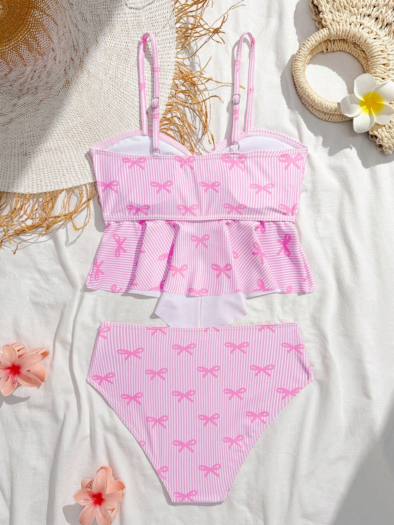 Tween girls 2-piece tankini swimwear set in apricot with a textured jacquard look, asymmetrical spaghetti-strap sleeveless top, and matching mid-waist short bikini bottoms.
