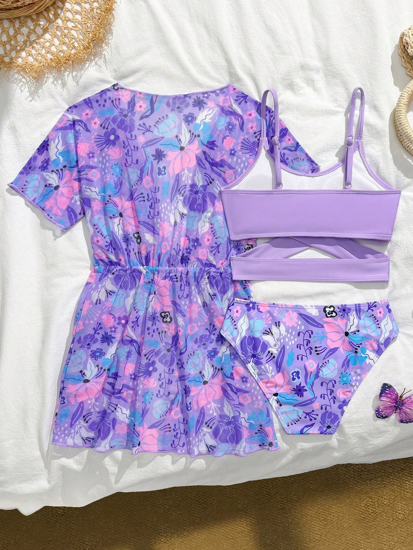 Three-piece tween girls swimwear set with a floral print, featuring a criss-cross bikini top, regular bikini bottoms, and a kimono cover-up in assorted prints.