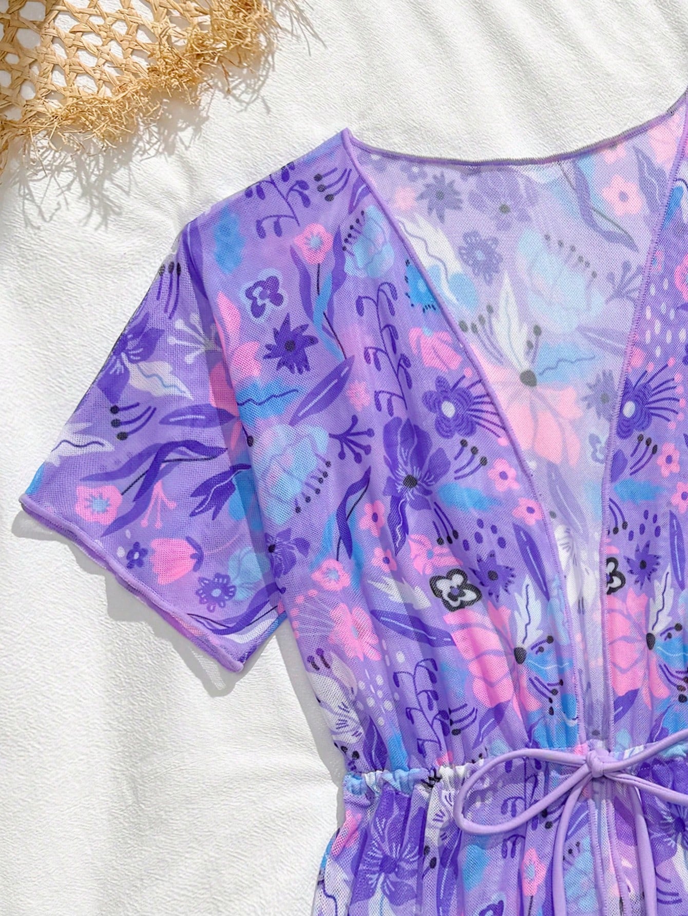 Three-piece tween girls swimwear set with a floral print, featuring a criss-cross bikini top, regular bikini bottoms, and a kimono cover-up in assorted prints.