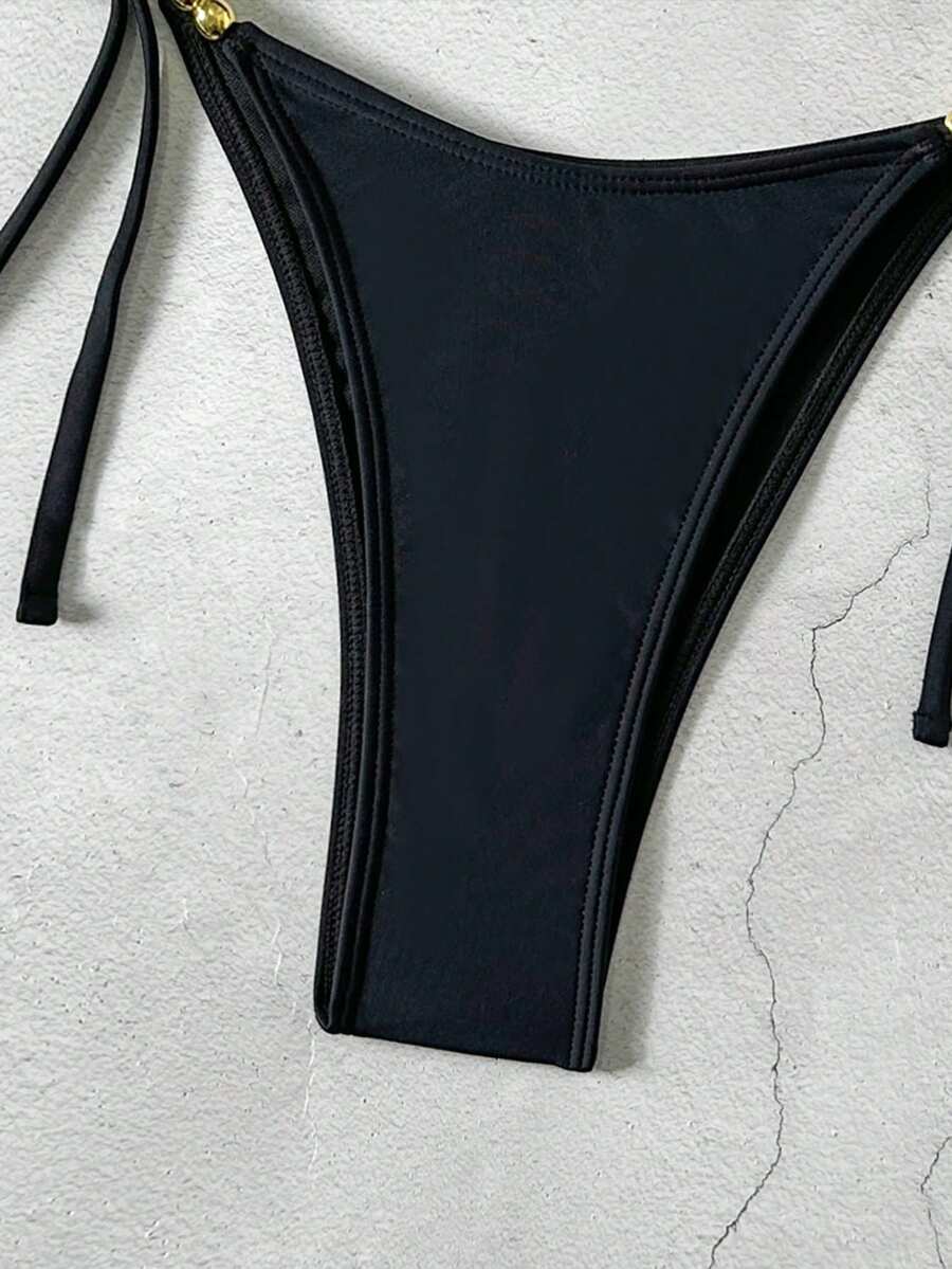 Women's black halter bikini set featuring triangle cups with gold bead decor and tie-back closure