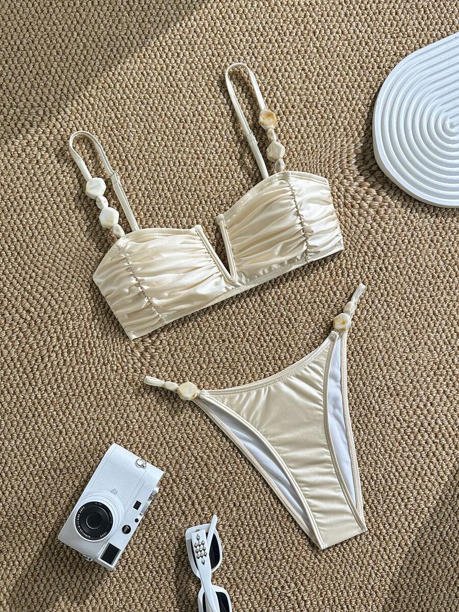 Apricot high waist two-piece bikini set for women featuring V-wired bandeau top with shell decor and high stretch swimwear fabric.