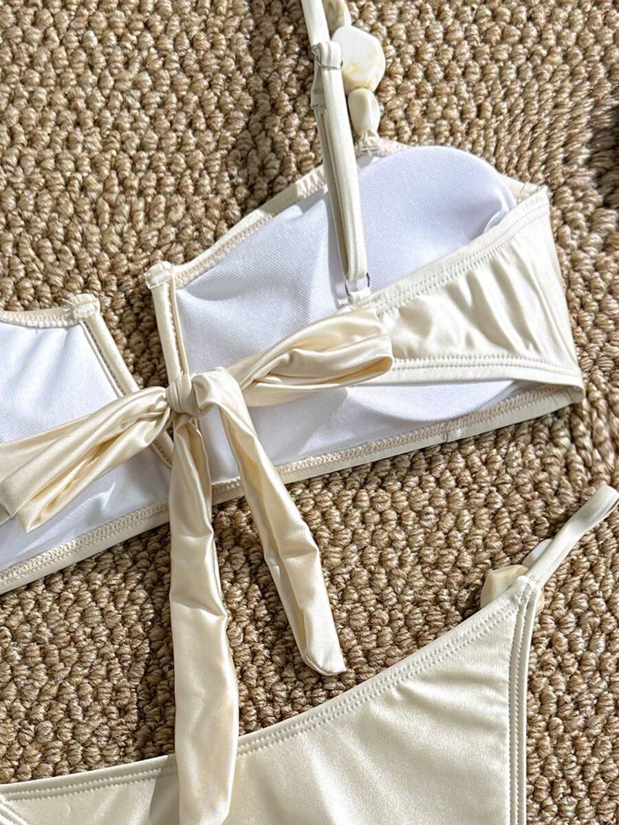 Apricot high waist two-piece bikini set for women featuring V-wired bandeau top with shell decor and high stretch swimwear fabric.