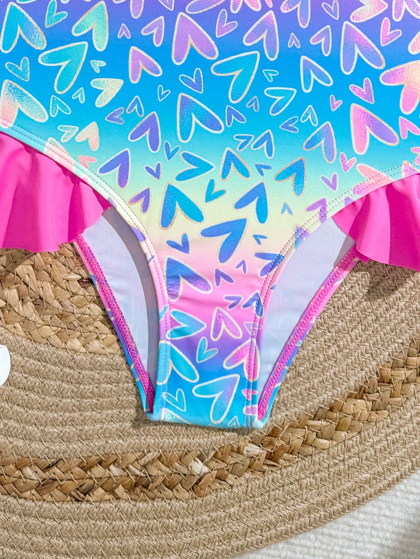 Tween girl plaid all-over print one-piece swimsuit with ruffle detail, spaghetti straps, fitted shape, and multicolor patchwork style for beach or pool wear.