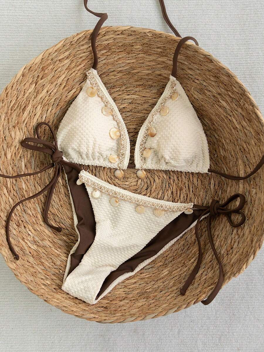 Apricot 2-piece bikini swimwear set featuring a textured halter triangle cup top with knot details and matching tie-side bottoms for women.