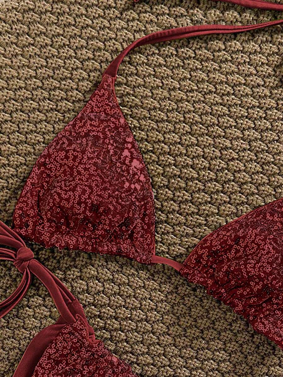 Women's apricot solid halter tie bikini top with triangle cups and matching tie-side swimsuit bottoms.