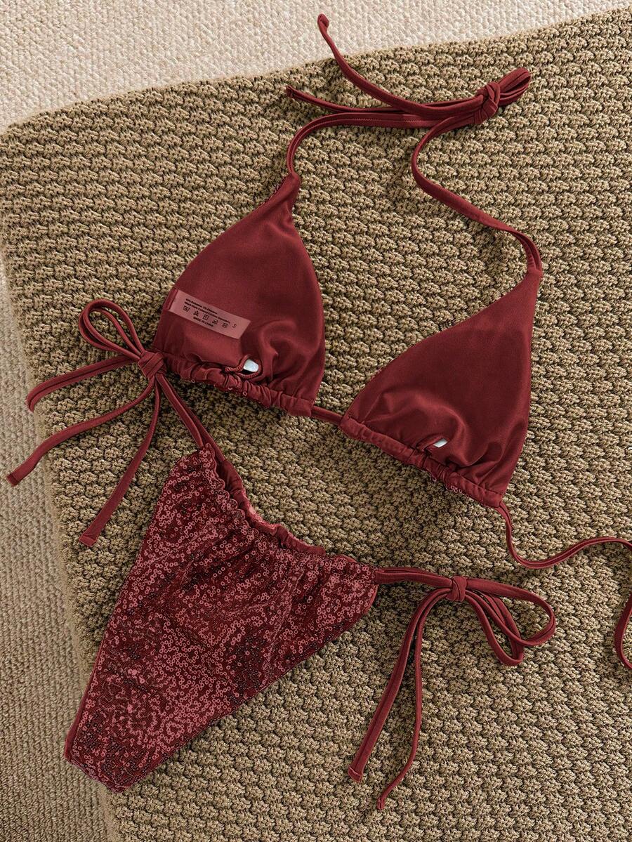 Women's apricot solid halter tie bikini top with triangle cups and matching tie-side swimsuit bottoms.