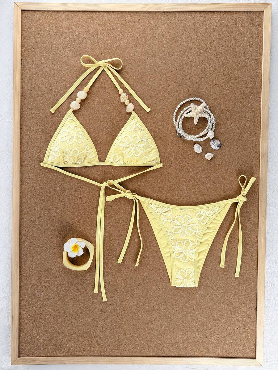 Women's apricot solid halter tie bikini top with triangle cups and matching tie-side swimsuit bottoms.