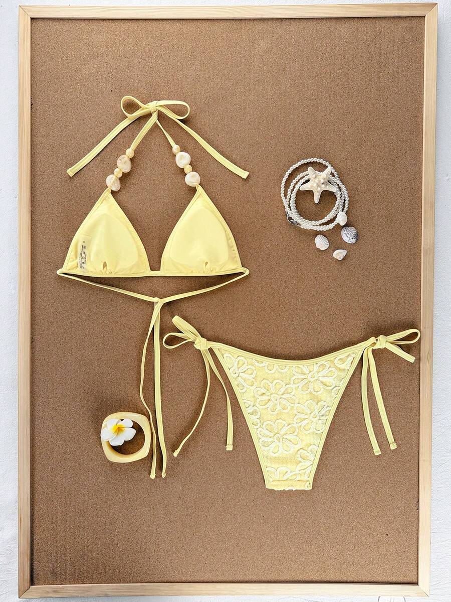 Women's apricot solid halter tie bikini top with triangle cups and matching tie-side swimsuit bottoms.