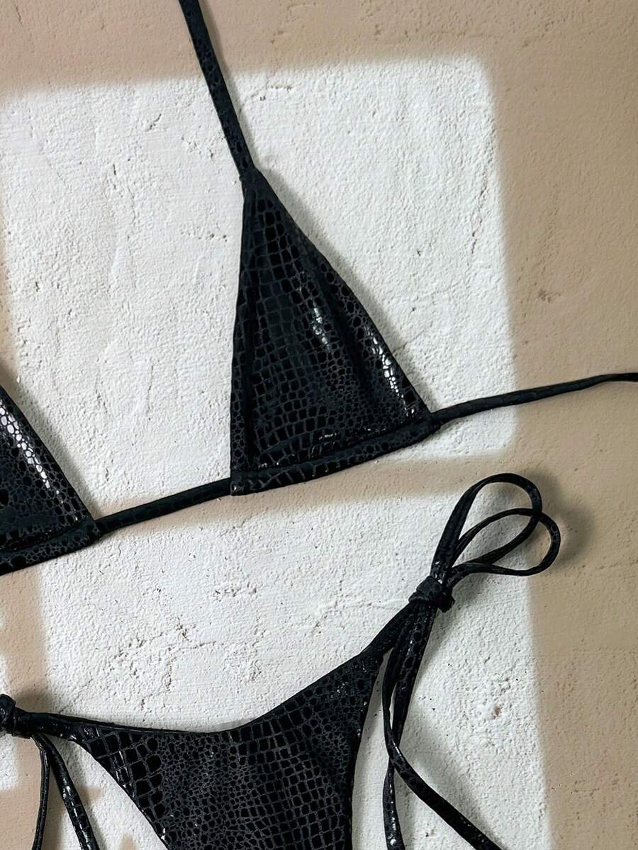 Black 2-piece snakeskin textured halter bikini set for women featuring high waist tie side bottoms and triangle cups.