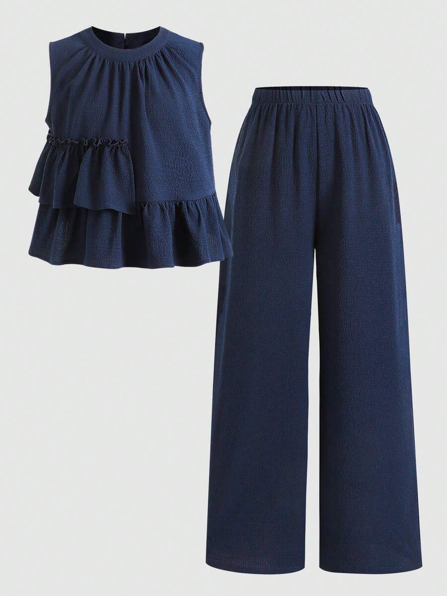 Tween girls blue striped sleeveless short top with button and ruffle details paired with matching long straight leg pants.