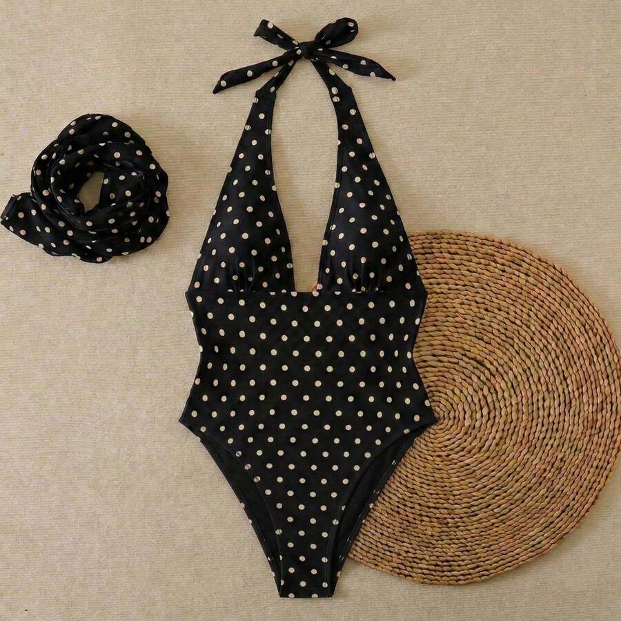 Women's apricot polka dot two-piece swimsuit featuring an asymmetrical halter backless top with knot tie detail and high-waisted bottoms.