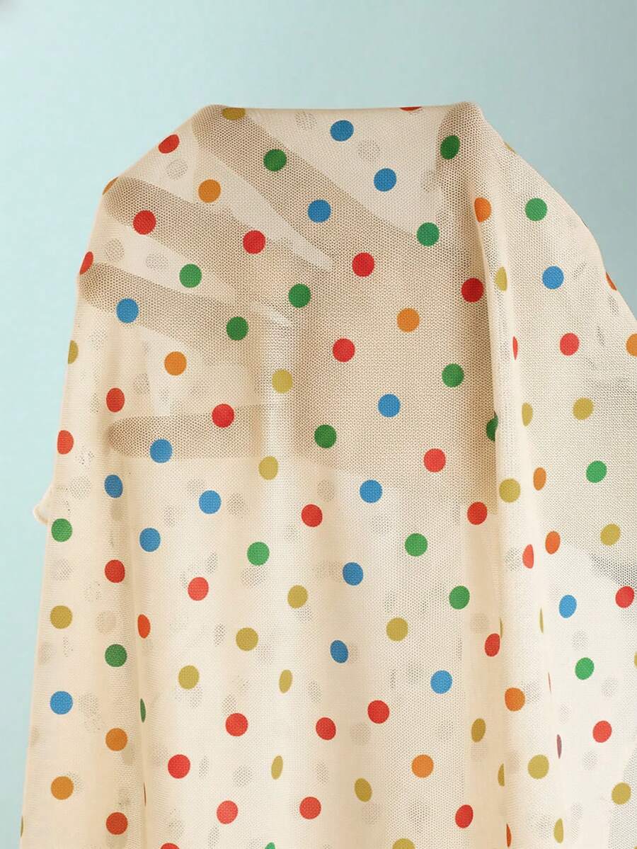 Women's apricot polka dot two-piece swimsuit featuring an asymmetrical halter backless top with knot tie detail and high-waisted bottoms.