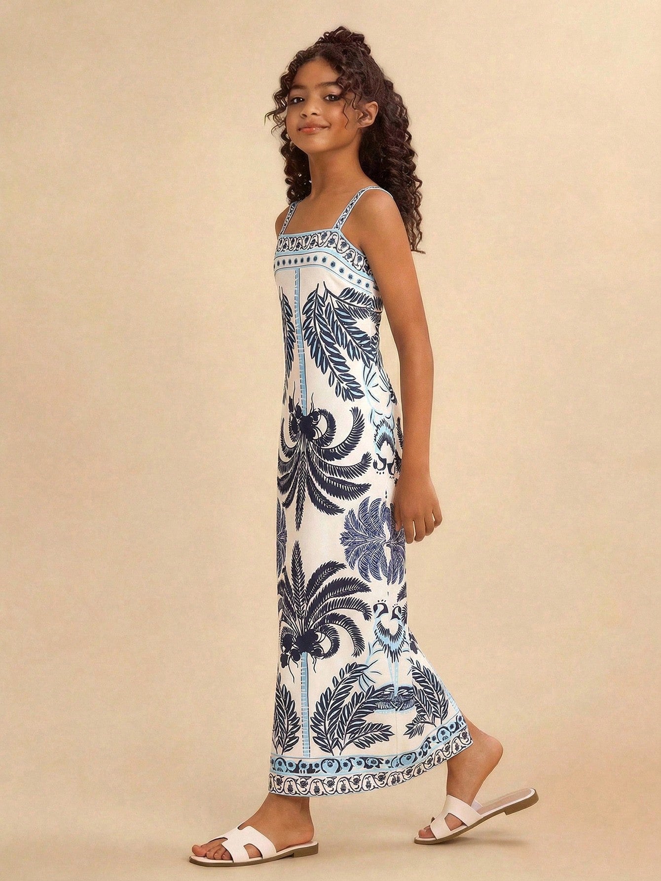 Tween girls' multicolor fruit print cami dress with spaghetti straps, sleeveless slim fit, split detail, natural waist, and long straight hem for vacation wear.