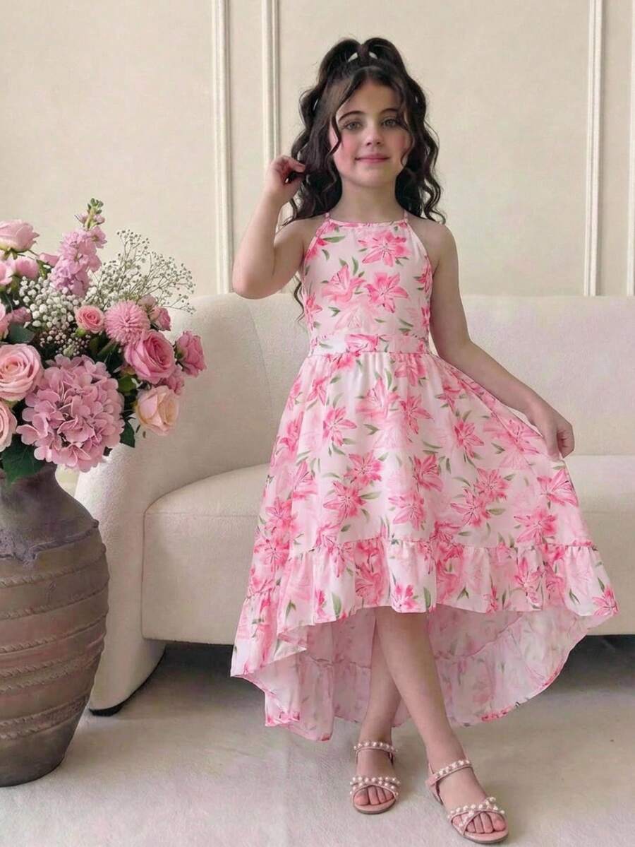 Pink floral print asymmetrical cami dress for tween girls featuring a high waist, sleeveless design, halter neckline, and back zipper.