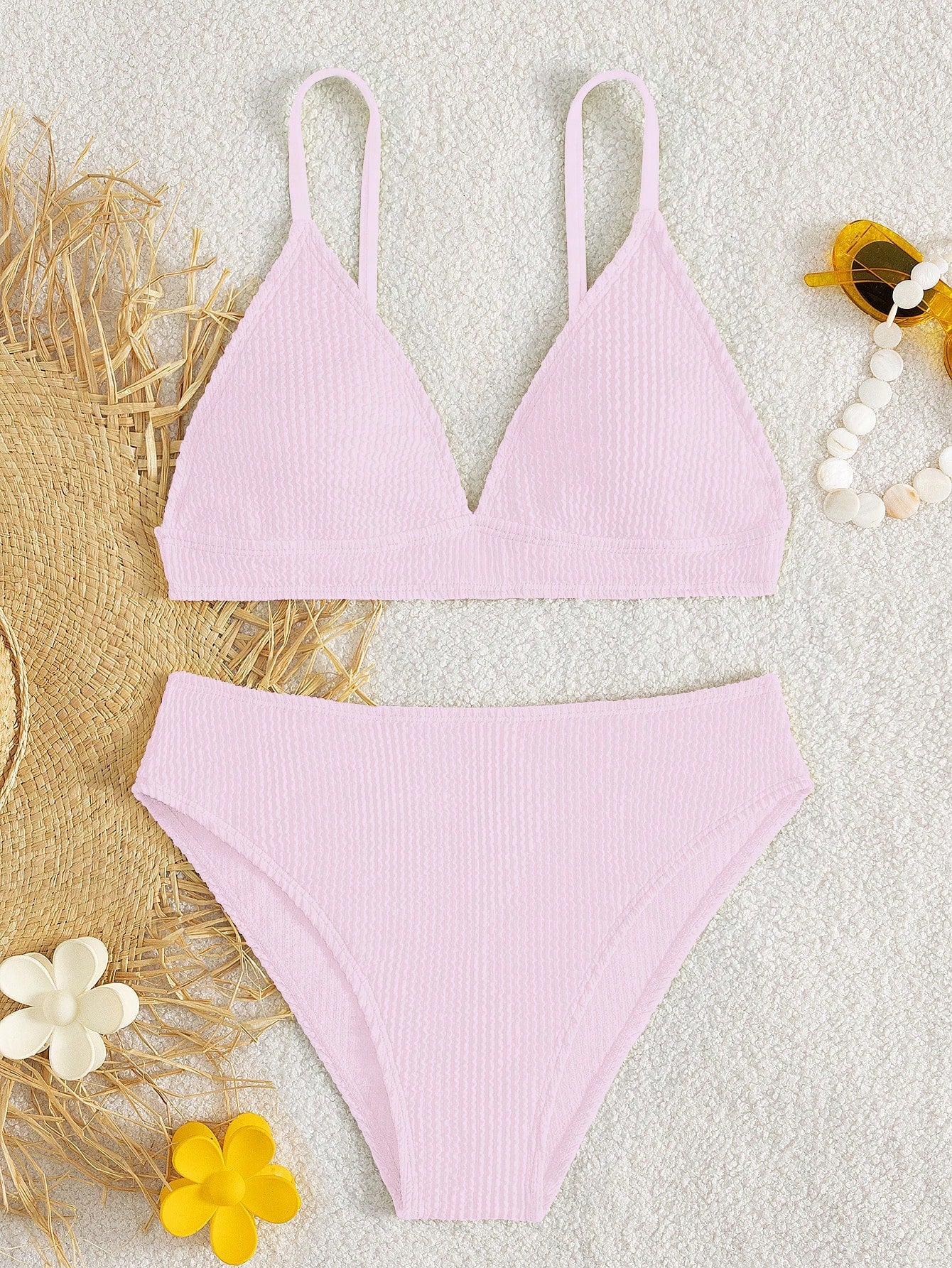 Tween girls two-piece bikini swimwear set with a solid color textured design, spaghetti strap top, wireless bra, and mid-waist lined bikini bottoms.