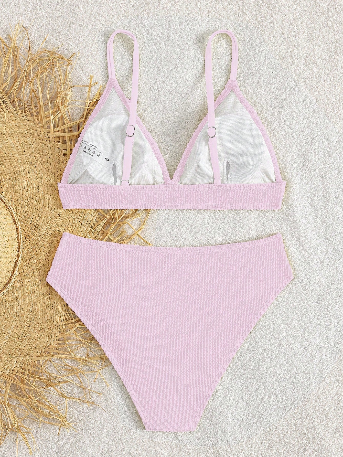 Tween girls two-piece bikini swimwear set with a solid color textured design, spaghetti strap top, wireless bra, and mid-waist lined bikini bottoms.