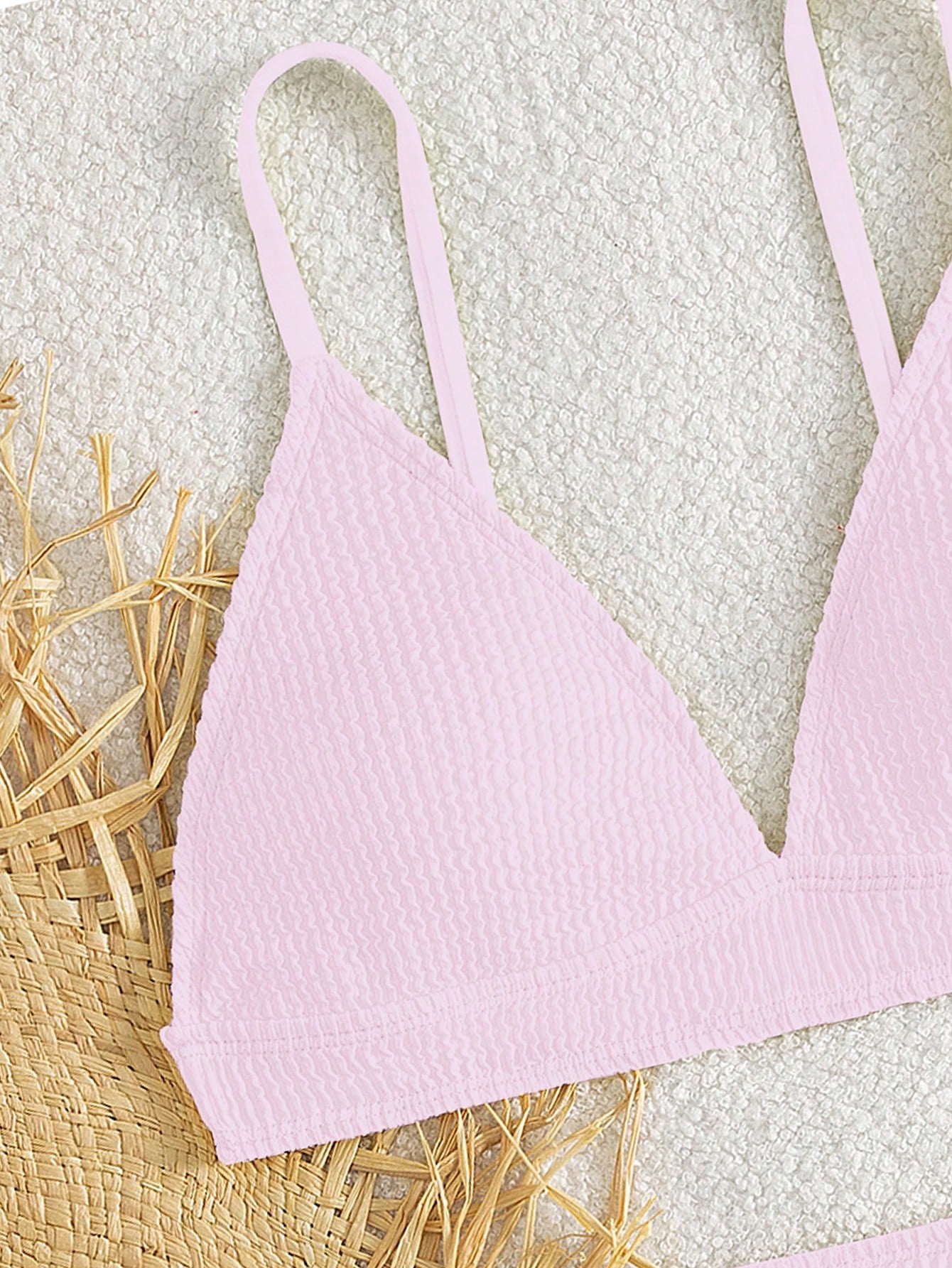 Tween girls two-piece bikini swimwear set with a solid color textured design, spaghetti strap top, wireless bra, and mid-waist lined bikini bottoms.