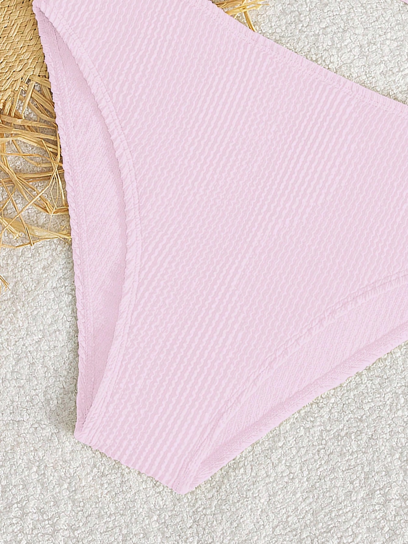 Tween girls two-piece bikini swimwear set with a solid color textured design, spaghetti strap top, wireless bra, and mid-waist lined bikini bottoms.