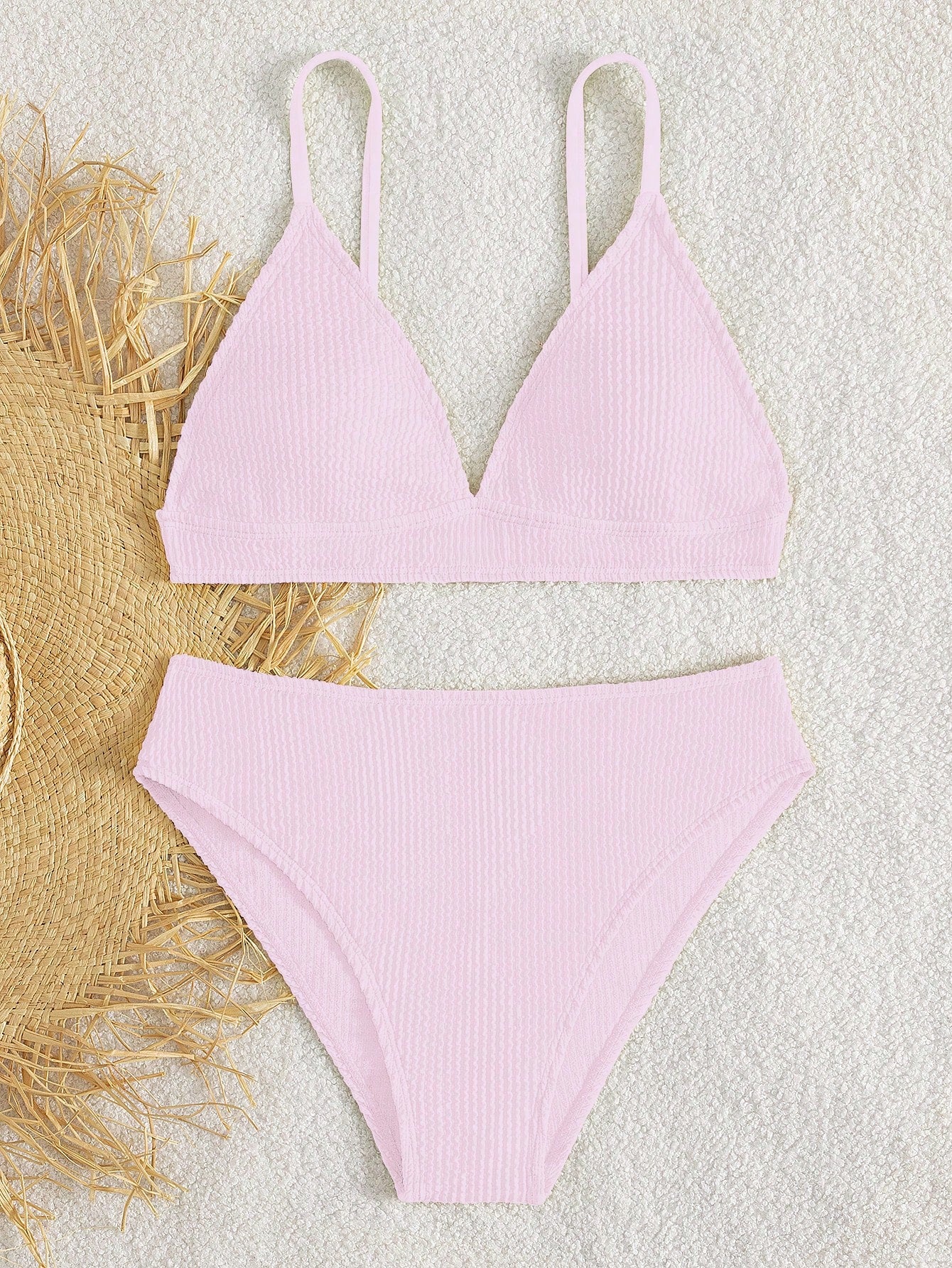 Tween girls two-piece bikini swimwear set with a solid color textured design, spaghetti strap top, wireless bra, and mid-waist lined bikini bottoms.