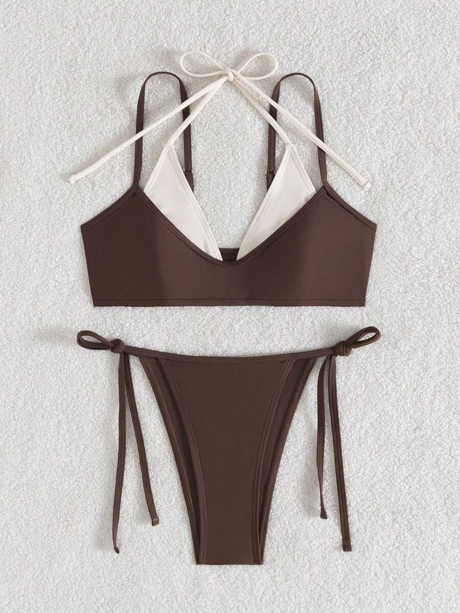 Women's color-block two-piece bikini set featuring a boho geometric pattern, tie-back halter top with removable padding, and matching tie-side bikini bottoms.