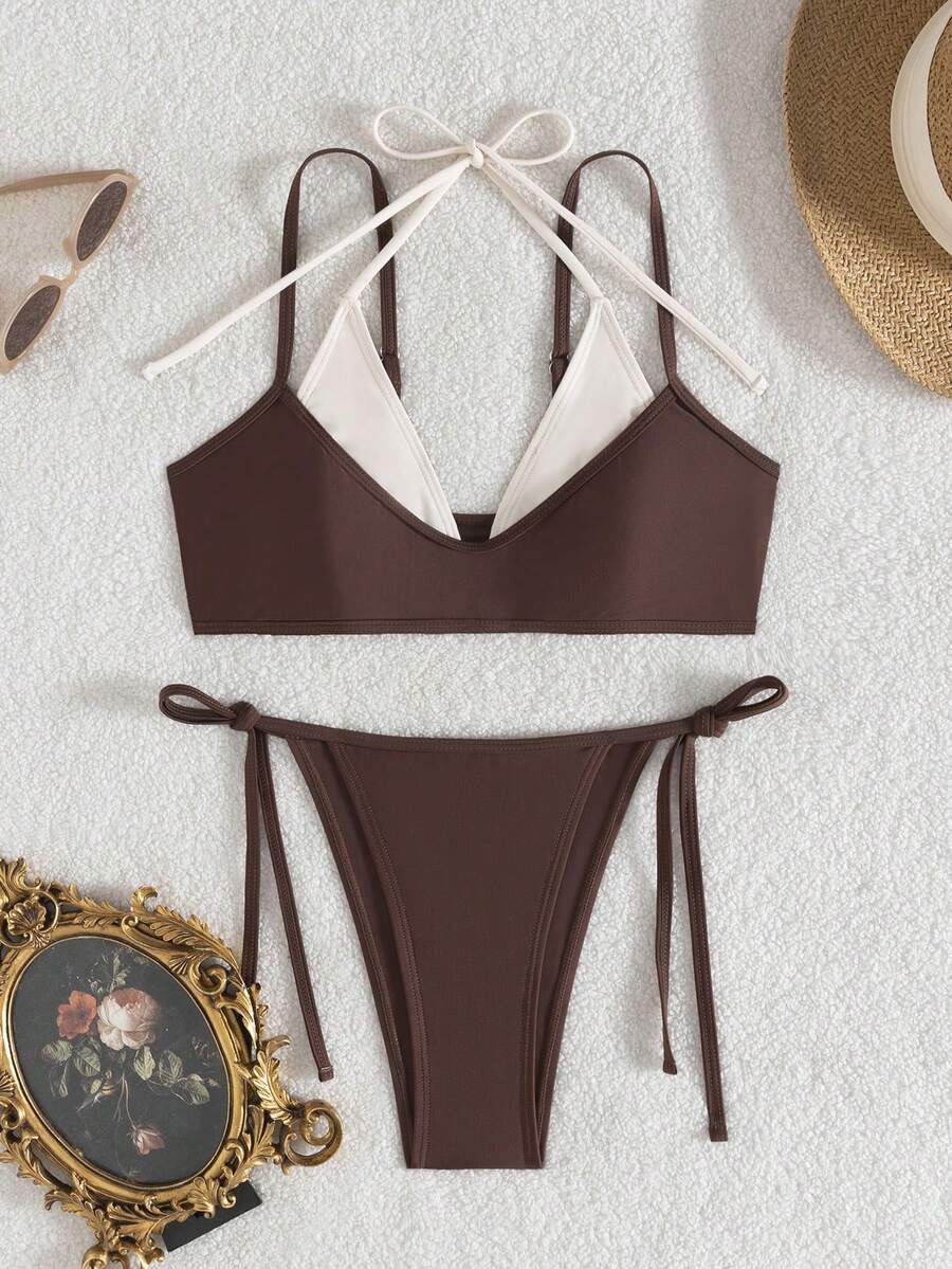 Women's color-block two-piece bikini set featuring a boho geometric pattern, tie-back halter top with removable padding, and matching tie-side bikini bottoms.