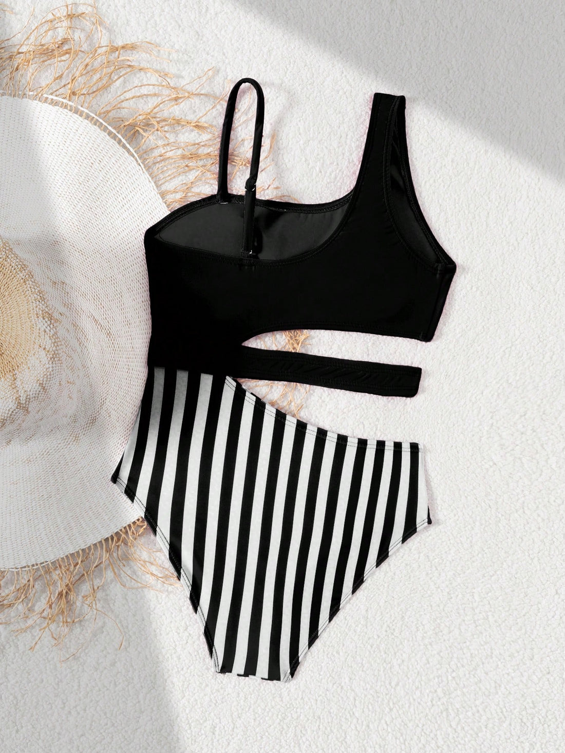 Purple tween girls one-piece swimsuit with asymmetrical neckline, cut-out waist, striped pattern, fitted silhouette, and lined body.