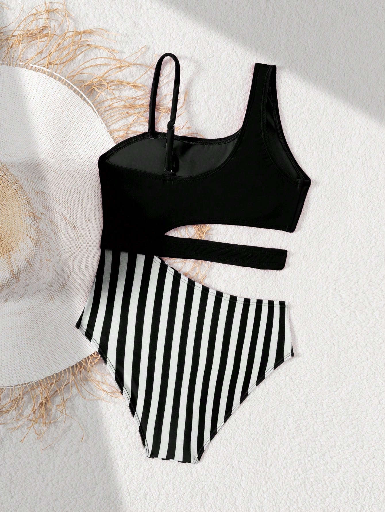 Purple tween girls one-piece swimsuit with asymmetrical neckline, cut-out waist, striped pattern, fitted silhouette, and lined body.