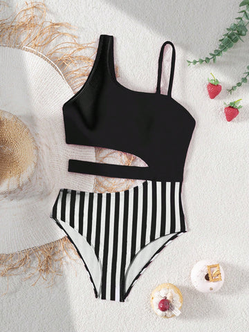 Purple tween girls one-piece swimsuit with asymmetrical neckline, cut-out waist, striped pattern, fitted silhouette, and lined body.