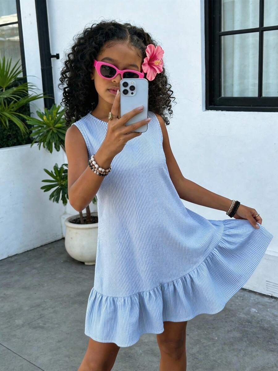 Tween girls casual leopard print smock mini dress featuring a round neck and flounce ruffle hem.