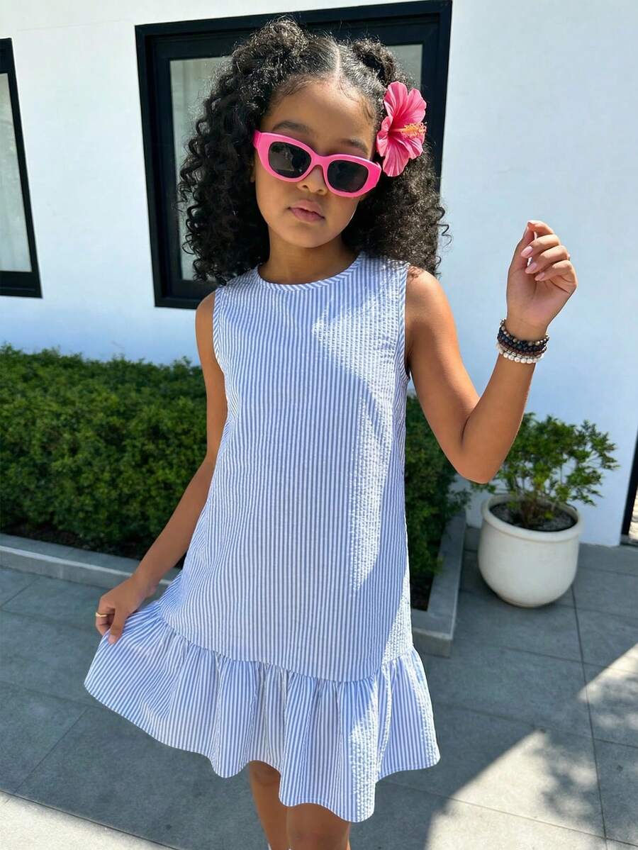 Tween girls casual leopard print smock mini dress featuring a round neck and flounce ruffle hem.