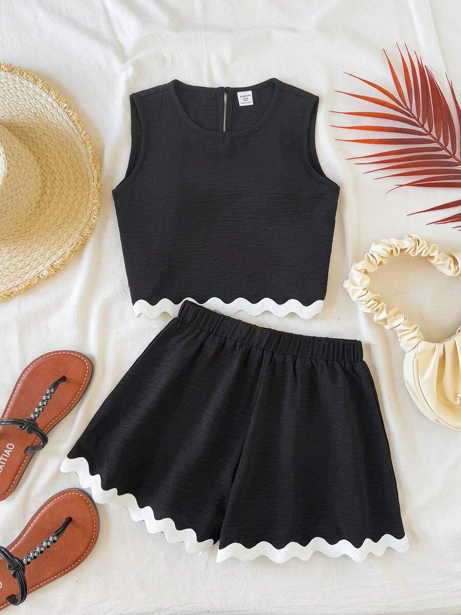 Tween girls army green casual outfit featuring a sleeveless round neck top with button details paired with matching woven loose shorts.