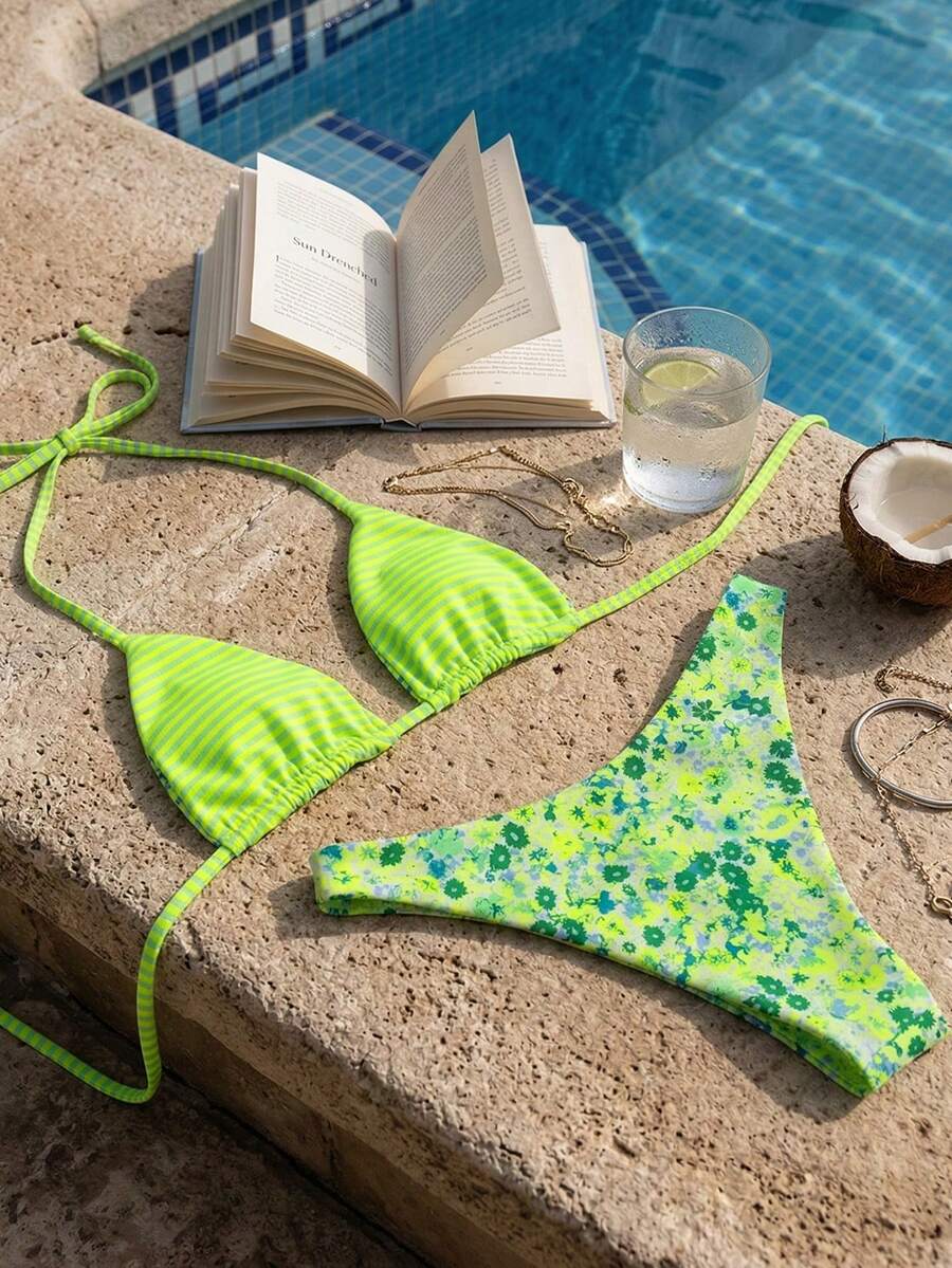 Women's two-piece halter bikini set featuring high cut thong bottoms and removable padding