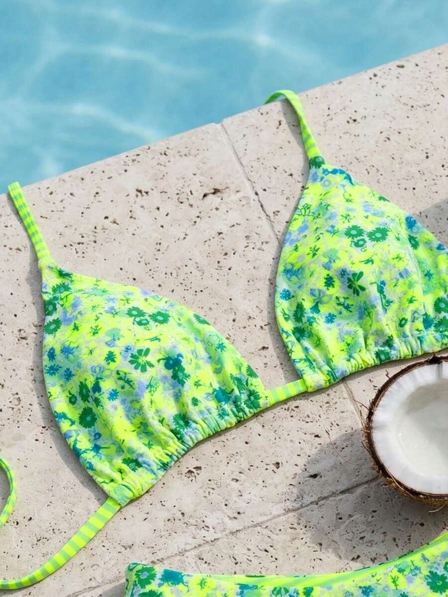 Women's two-piece halter bikini set featuring high cut thong bottoms and removable padding