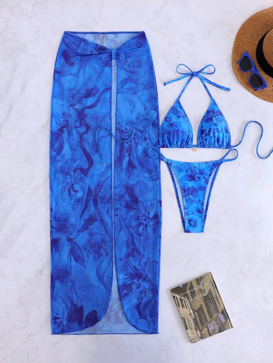 Women's 3-piece floral swimsuit set featuring a multicolor tie-back halter bikini top, low-waist bottoms, and a matching sheer mesh maxi skirt.