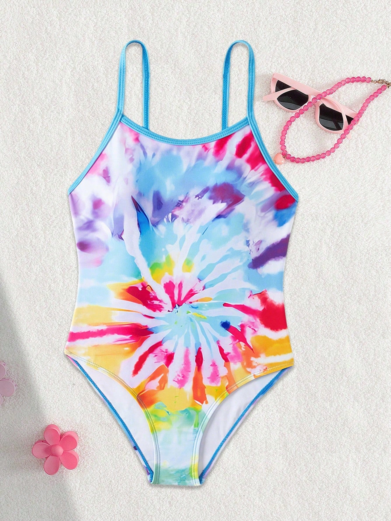 Multicolor plant print one-piece swimsuit for tween girls with spaghetti neckline, adjustable straps, fitted shape, and lined body for summer swimming and vacation.
