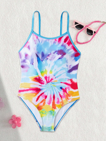 Multicolor plant print one-piece swimsuit for tween girls with spaghetti neckline, adjustable straps, fitted shape, and lined body for summer swimming and vacation.