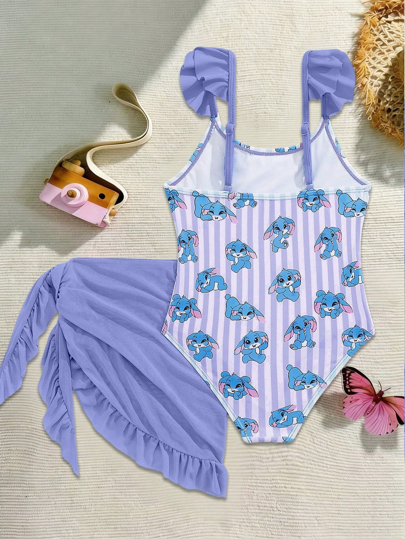 Tween girls one-piece swimsuit in leopard print with ruffle shoulder straps, scoop neckline, fitted shape, and attached ruffle hem skirt; sleeveless, mid-waist skirt bottom, and lined body for swimming, vacation, and summer beach wear.
