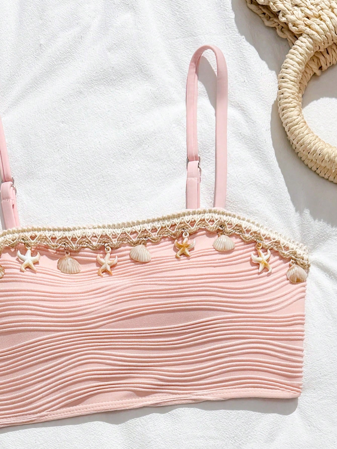 Tween girls bikini set with shell and starfish woven band details, spaghetti strap sleeveless top, and mid-waist skirt-style bottom in blue.