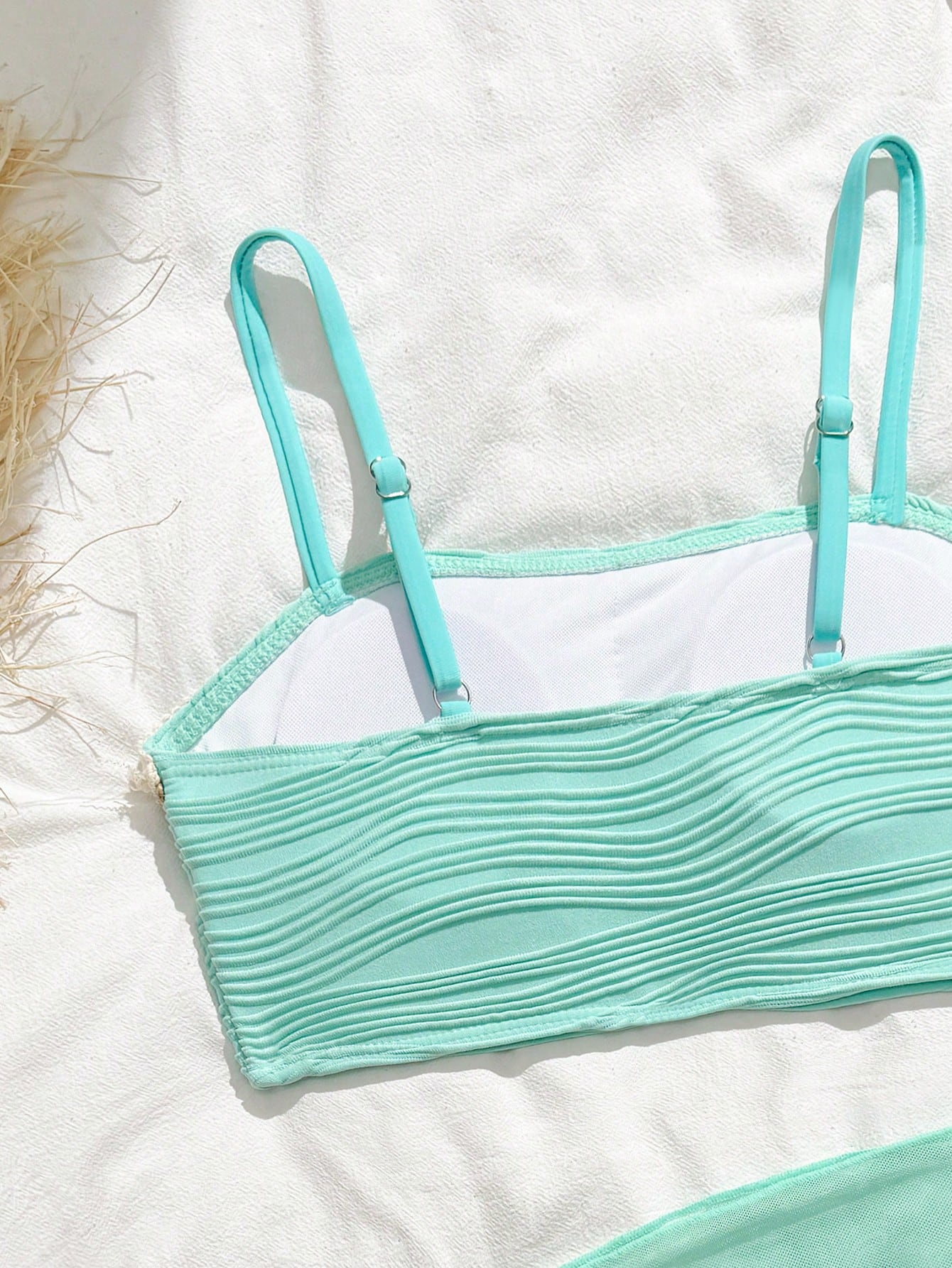 Tween girls bikini set with shell and starfish woven band details, spaghetti strap sleeveless top, and mid-waist skirt-style bottom in blue.