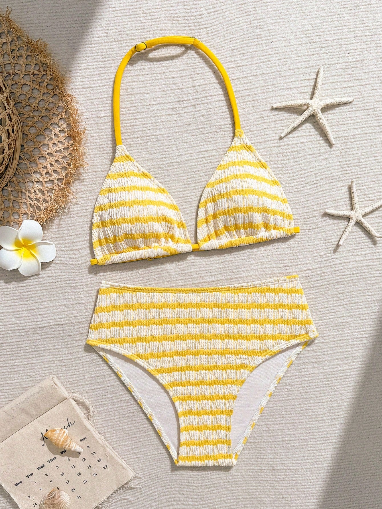 Tween girls blue and white striped two-piece bikini set with halter triangle top and mid-waist short bikini bottoms for beach and vacation swimwear.