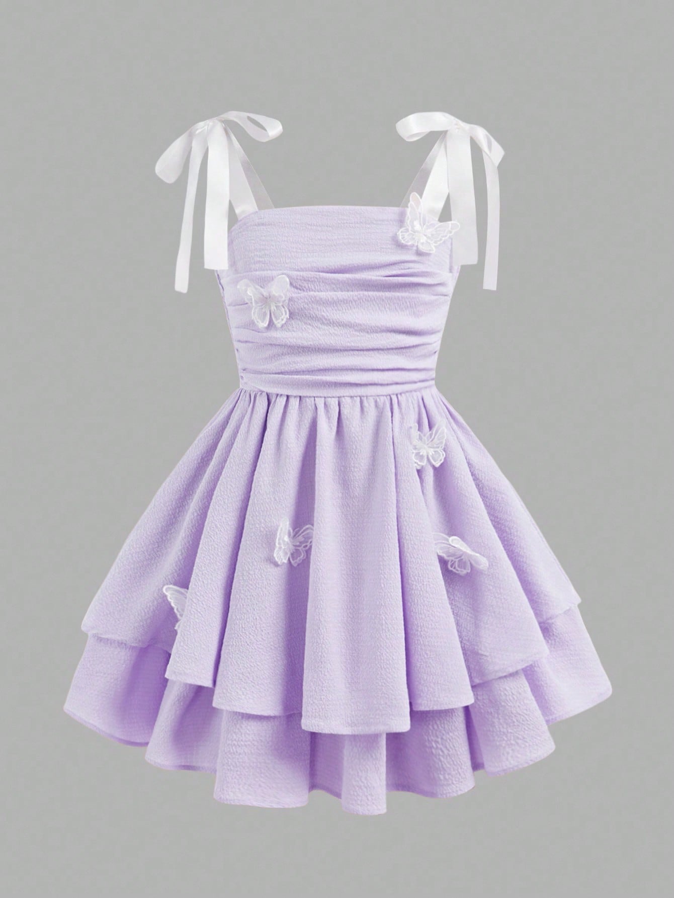 Tween girls apricot tiered cami dress with spaghetti straps, high waist, and slim fit layered hem.