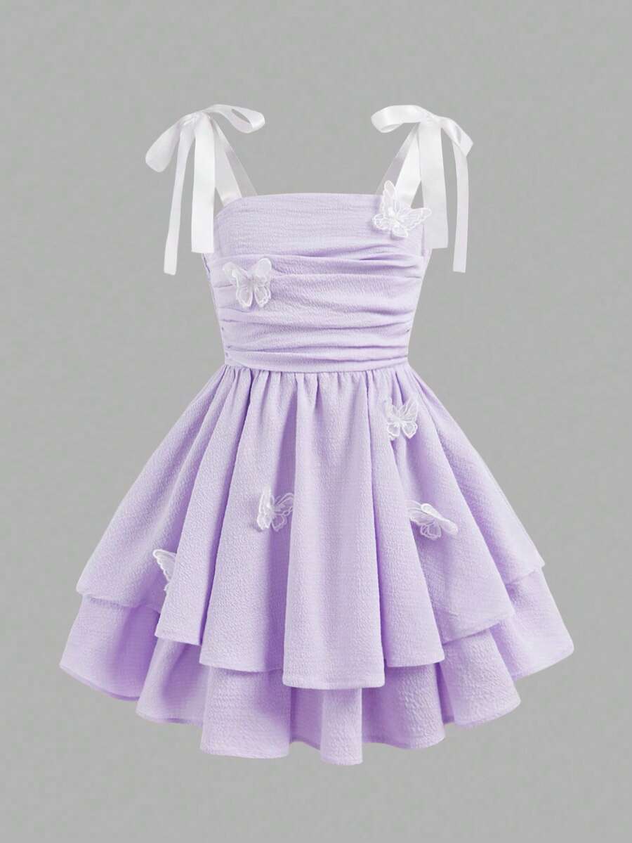 Tween girls apricot tiered cami dress with spaghetti straps, high waist, and slim fit layered hem.