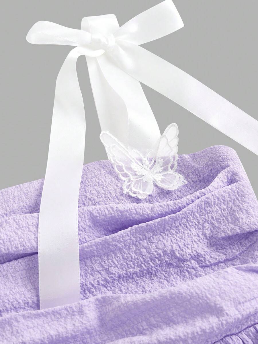 Tween girls apricot tiered cami dress with spaghetti straps, high waist, and slim fit layered hem.