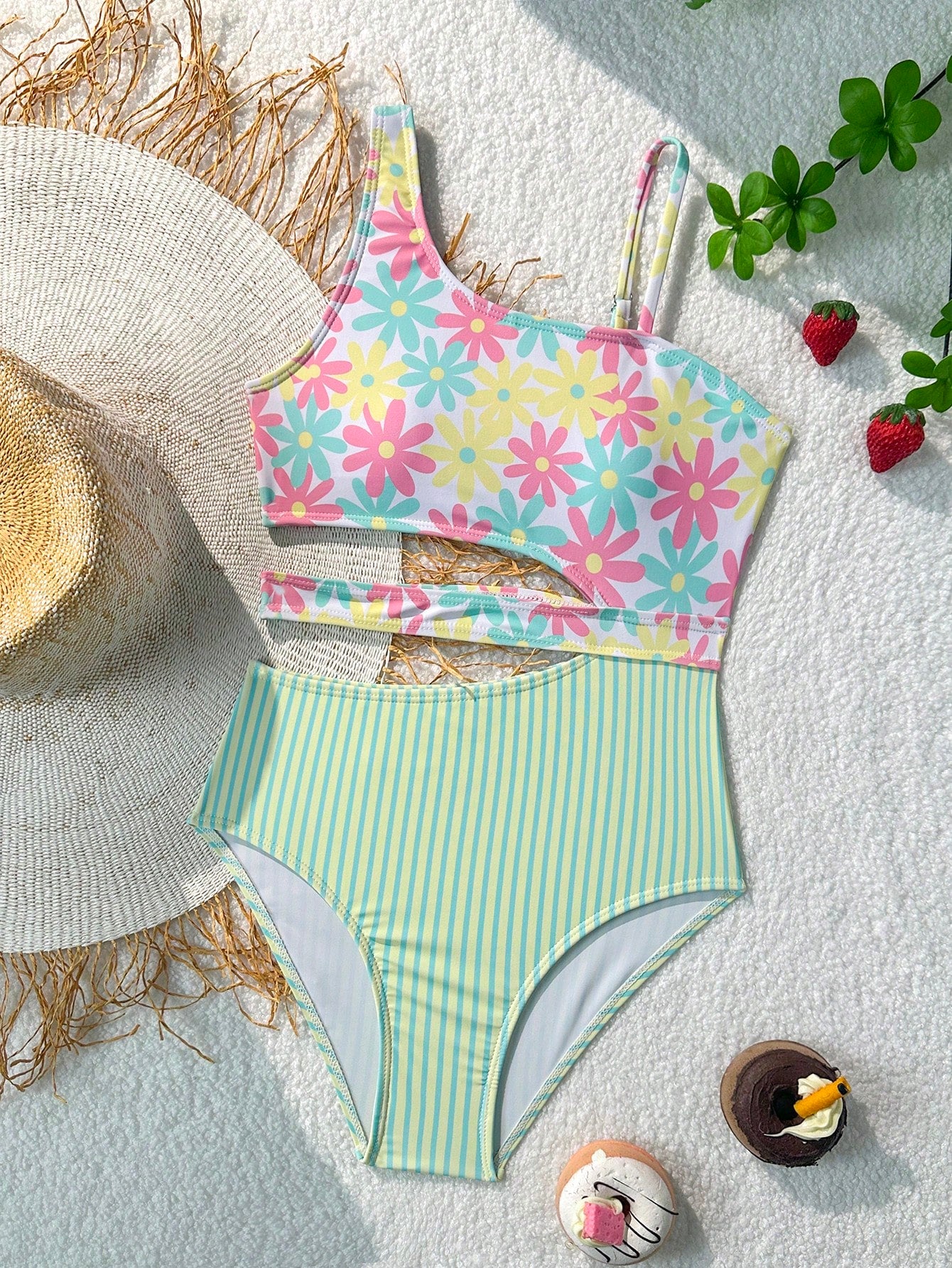Purple tween girls one-piece swimsuit with asymmetrical neckline, cut-out waist, striped pattern, fitted silhouette, and lined body.