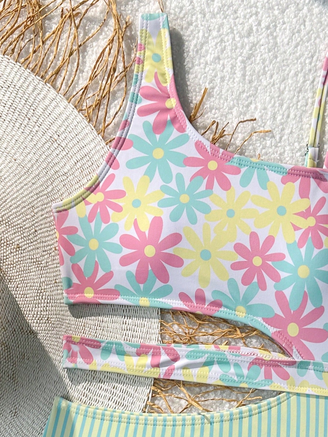 Purple tween girls one-piece swimsuit with asymmetrical neckline, cut-out waist, striped pattern, fitted silhouette, and lined body.