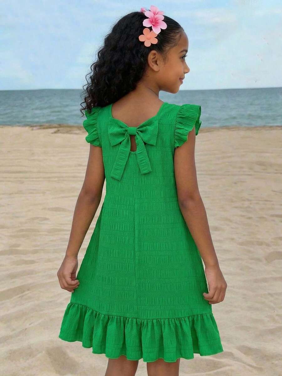 Tween girls apricot vacation midi dress featuring a round neck, cut out details, ruffle flounce accents, and geometric pattern.
