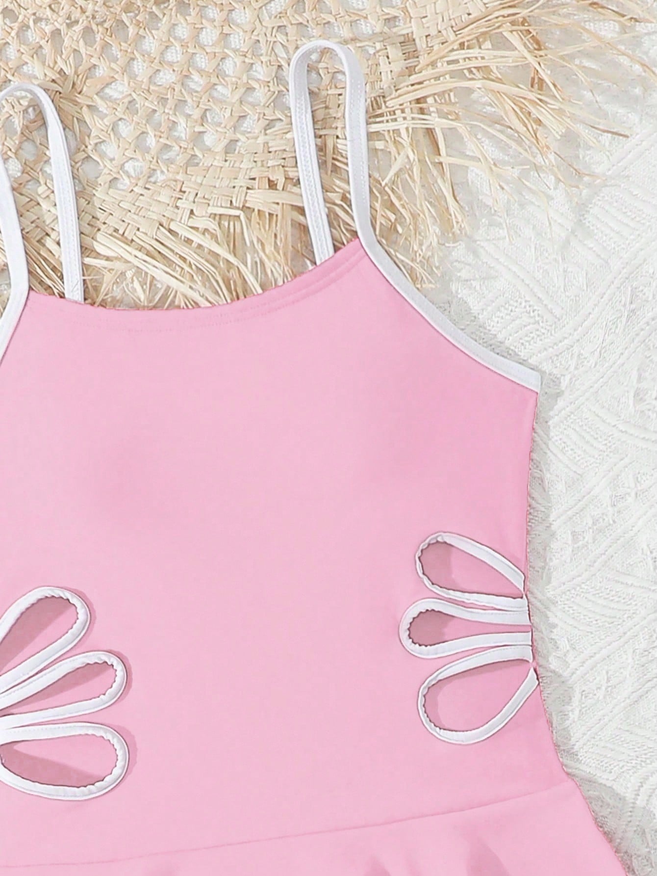 Tween girls black two-piece tankini swimwear set featuring a spaghetti strap sleeveless top with cutout detail and contrast piping, paired with short swim shorts.